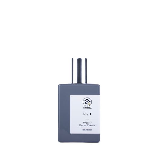 Haoma Organic Eau de Parfum No. 1 Blend. Natural fragrance. The perfume is pictured in a glass bottle painted grey, with an aluminium cap and white label.