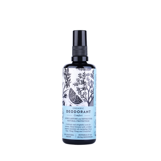 Haoma Organic Deodorant in Comfort. Natural menopause deodorant. The spray deodorant is packaged in a black glass bottle with a blue label and black illustrations of plants.