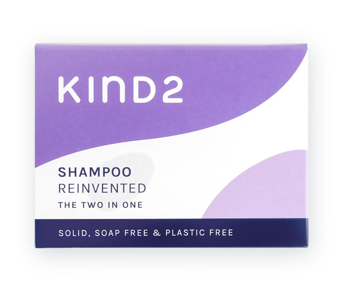 An image of the white and purple cardboard box of the KIND2 two in one shampoo bar