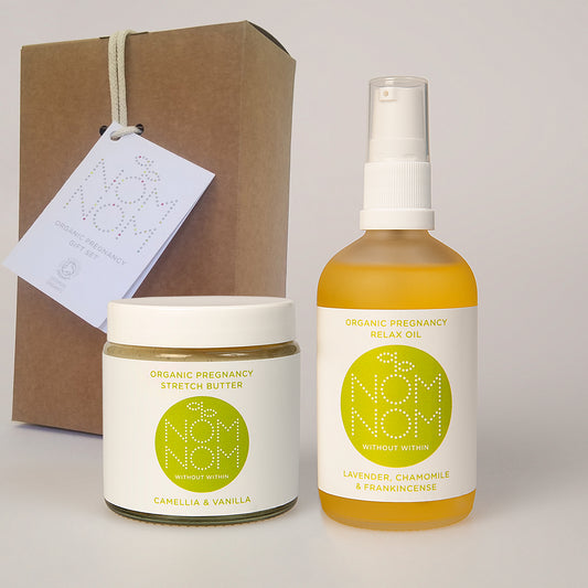 Nom Nom Skincare Organic Pregnancy Gift Set - bottle of Relax Oil next to jar of Stretch Butter with kraft gift box behind. Natural Pregnancy gifts