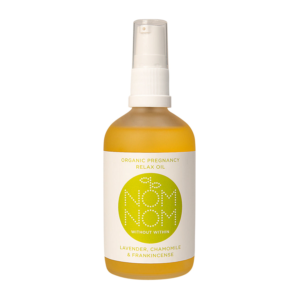 Nom Nom Organic Pregnancy Relax Oil Lavender Chamomile and Frankincense. Translucent glass bottle with white pump and clear lid. White label with Nom Nom name and logo and green writing that reads ‘organic pregnancy relax oil’ ‘without within’