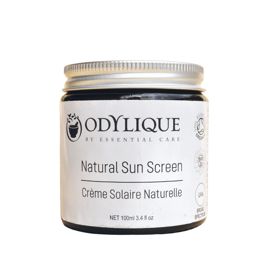 Odylique Natural Mineral Sun Screen SPF 30. Organic Sun Screen. Pictured in an amber glass jar with an aluminium lid.