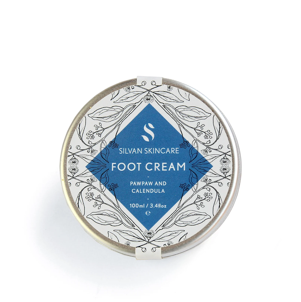 Silvan Skincare Foot Cream. Vegan foot treatment. The cream is packaged in an aluminium tub with a delicately illustrated white and blue label.