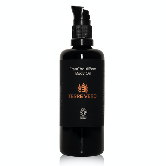Terre Verdi FranChouliPom Body Oil Full Size. Certified organic bodycare. In a black glass bottle with a black plastic pump. There is a black label with the label in gold in the centre and white text otherwise.