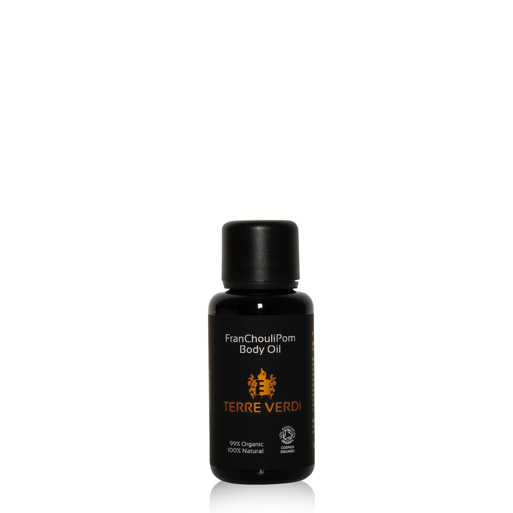 Terre Verdi FranChouliPom Body Oil Travel Size. Certified organic bodycare. In a black glass bottle with a black plastic lid. There is a black label with the label in gold in the centre and white text otherwise.