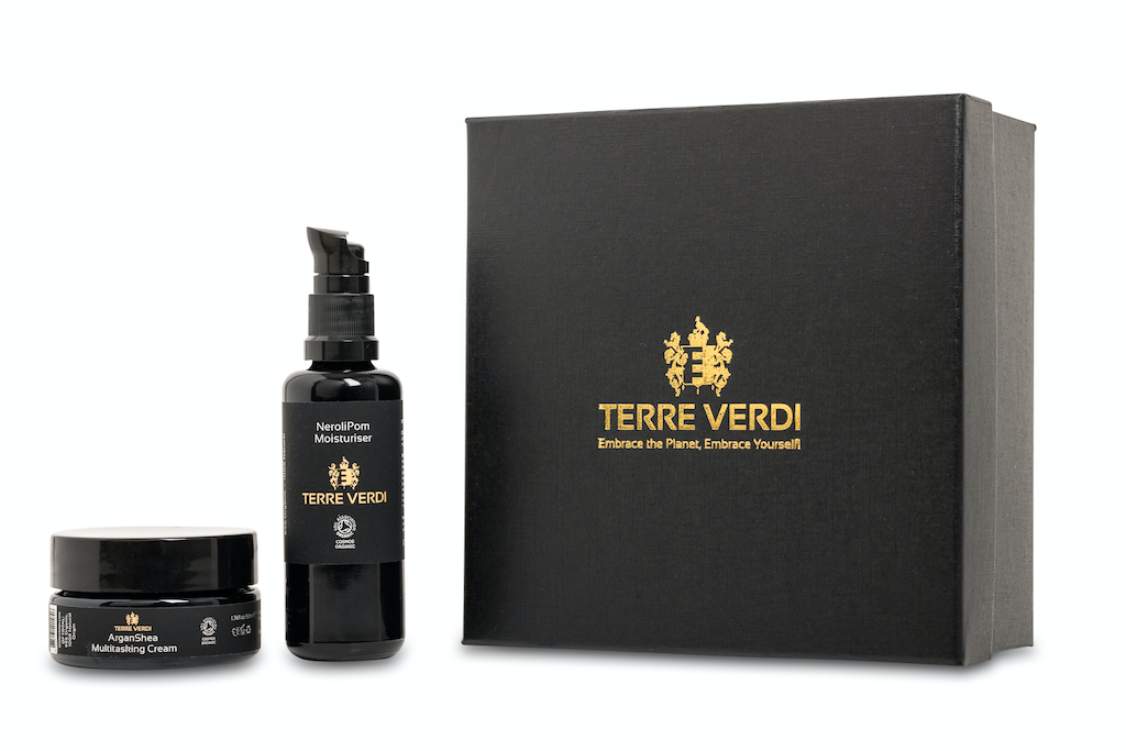 Terre Verdi Self Care Gift Set. Certified organic skincare gift set. Both products are in black bottles and stand next to a luxury black box embossed in gold with the Terre Verdi logo.