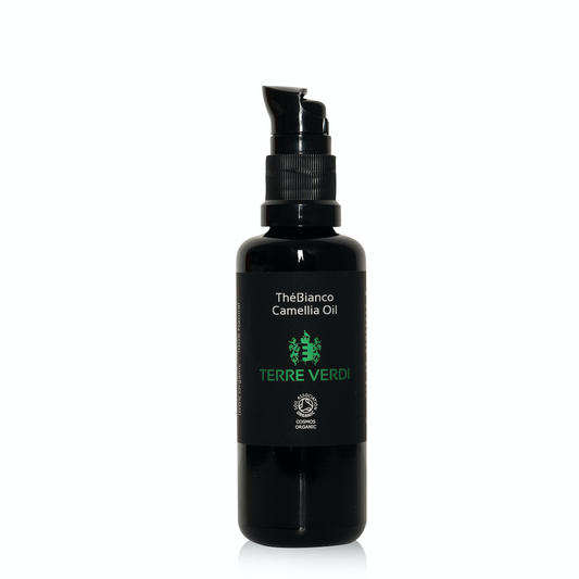Terre Verdi TheBianco Camellia Oil. Certified organic skin oil. Sensitive skin. In a black glass bottle with a black plastic pump. The label is black with the logo in green and other text in white.