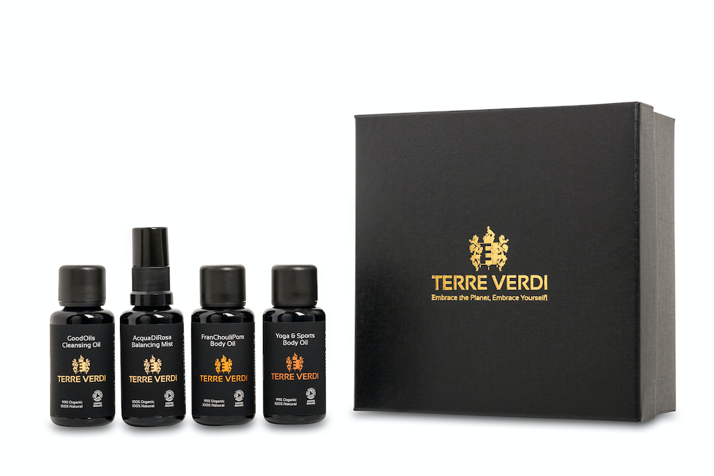 Terre Verdi Organic Travel Gift Set. Natural skincare gift set. All of the products are in black bottles and stand next to a luxury black box embossed in gold with the Terre Verdi logo.