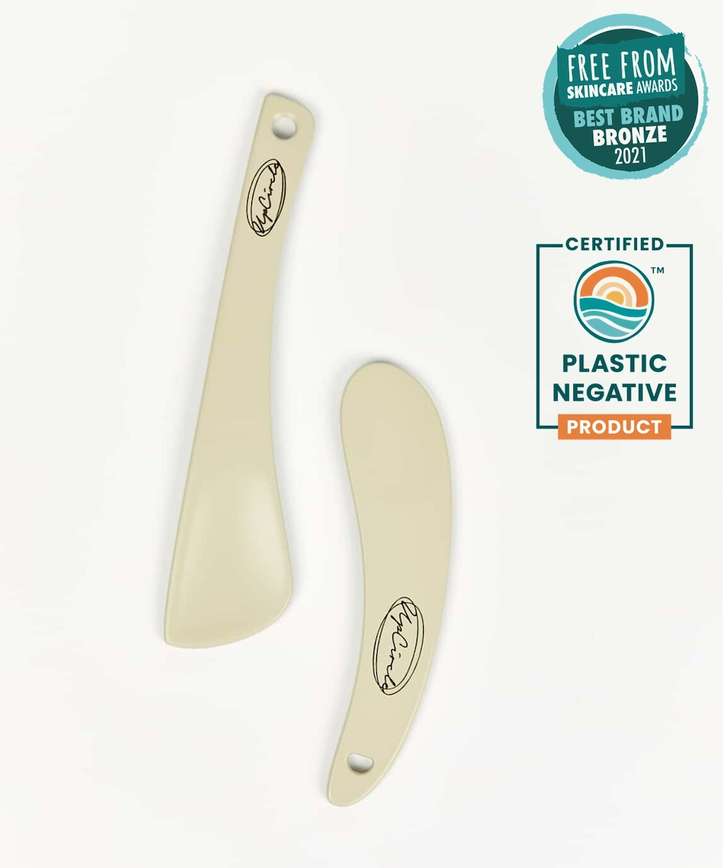 Upcricle Cosmetic Spatulas. Plastic free beauty. The spatulas are pictured on a white surface, with a logo certifying the product as "Plastic Negative" and the label for an award from the Free From Skincare Awards for Bronze in Best Brand 2021.
