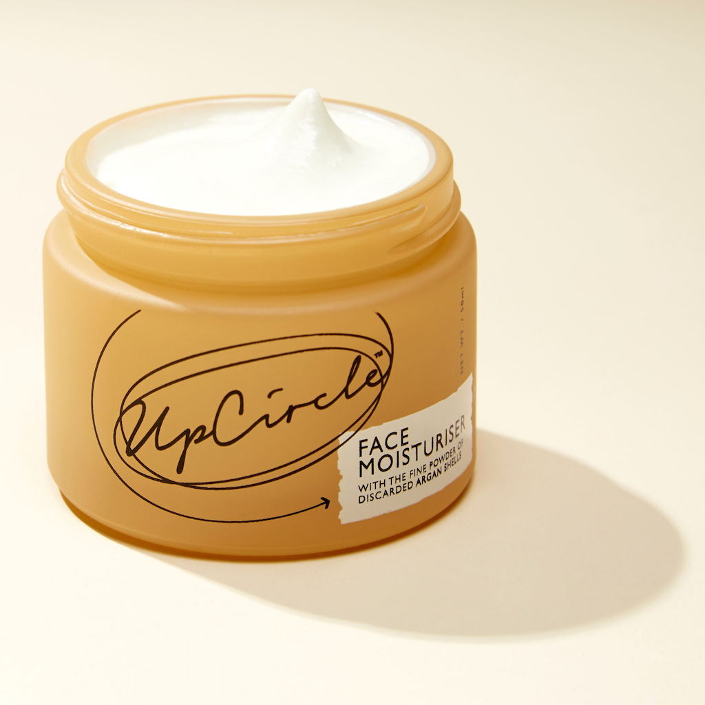 photo of an open jar of upcircle face moisturiser so you can see the white creamy texture